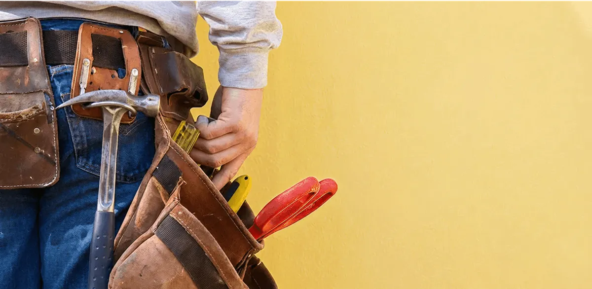 Handyman with tool belt ready for home repairs and maintenance in Clearwater, FL