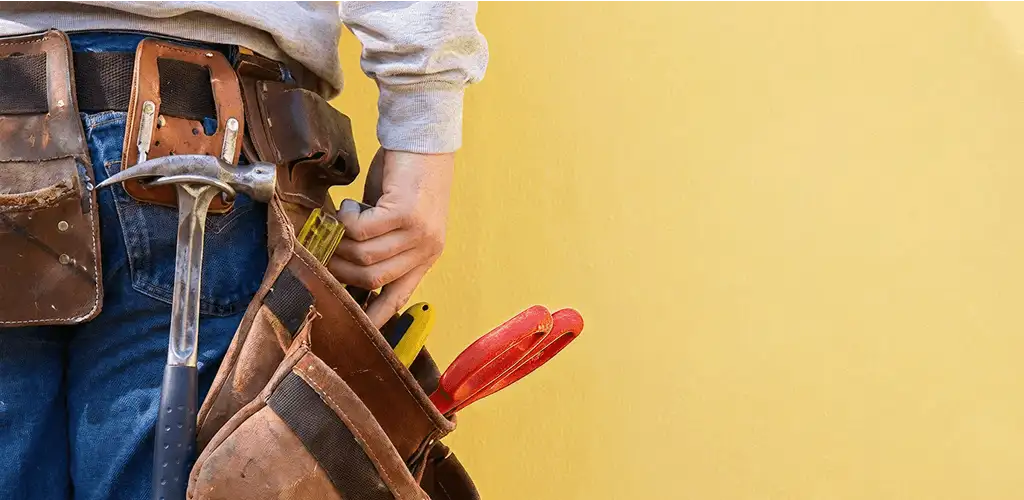 Handyman with tool belt ready for home repairs and maintenance in Clearwater, FL